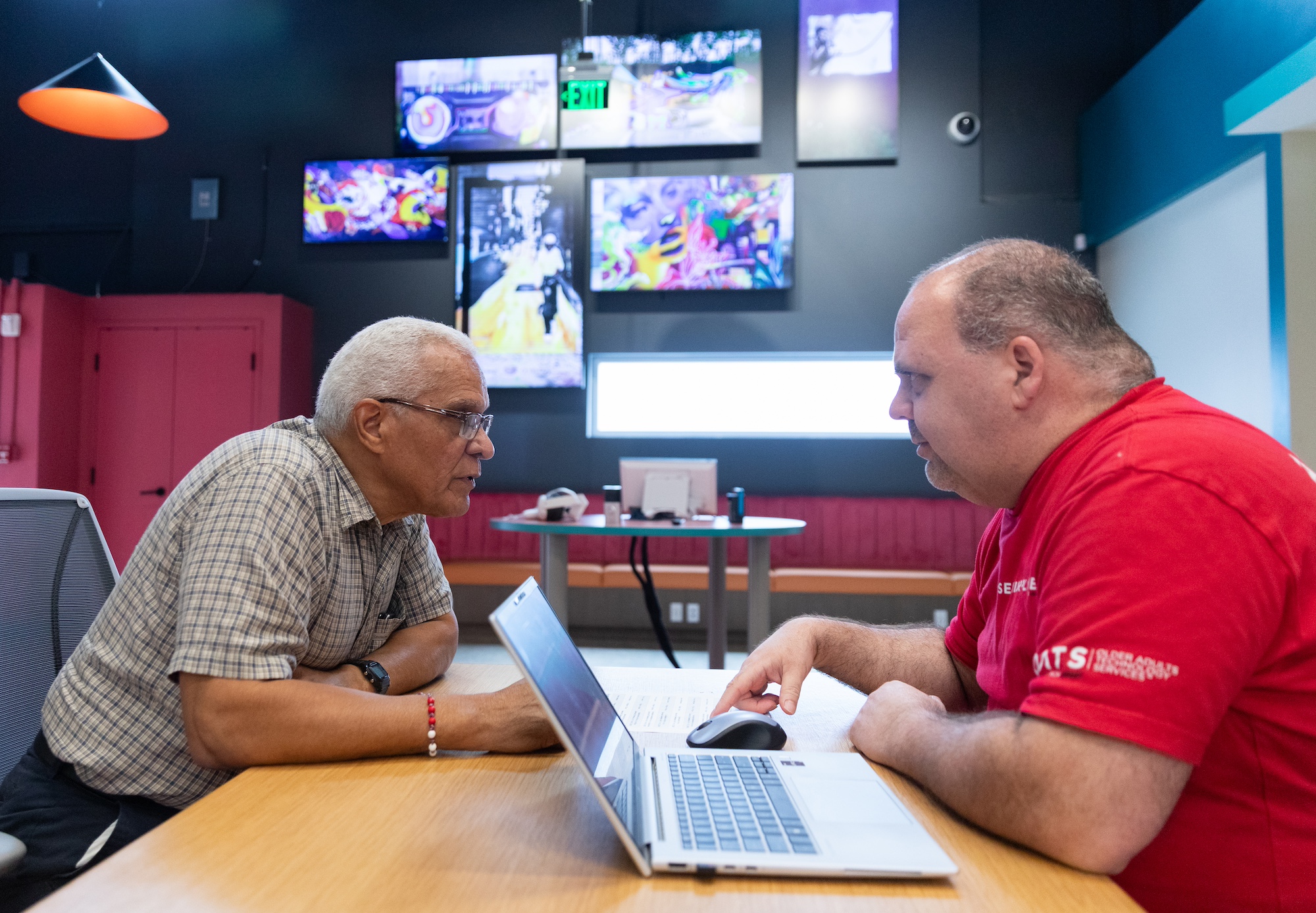 senior man receiving tech help