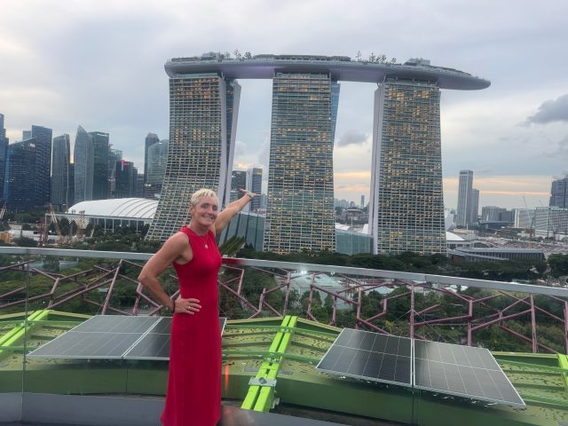 senior woman in red dress in Singapore at World Aquatics Masters Championships 2025